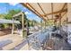 Expansive covered deck with a pergola, dining area, and multiple seating zones offers outdoor relaxation at 2316 Watson Fain Trl, Loganville, GA 30052