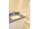 Bathroom vanity features a black countertop and white cabinets at 2969 Wynhaven Oaks Way, Lawrenceville, GA 30042