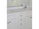 Bathroom featuring double sinks, a mirror, and white cabinets at 2969 Wynhaven Oaks Way, Lawrenceville, GA 30042