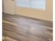 Bedroom features gray-toned wood-style laminate flooring, a white door, and a window with blinds at 2969 Wynhaven Oaks Way, Lawrenceville, GA 30042