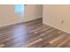 Bright bedroom features modern gray laminate wood flooring at 2969 Wynhaven Oaks Way, Lawrenceville, GA 30042
