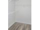Features gray laminate flooring and metal shelving in the closet at 2969 Wynhaven Oaks Way, Lawrenceville, GA 30042