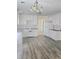 Spacious kitchen features white cabinets and leads to a dining area at 2969 Wynhaven Oaks Way, Lawrenceville, GA 30042