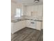 Well-lit kitchen with white cabinets and stainless steel appliances at 2969 Wynhaven Oaks Way, Lawrenceville, GA 30042