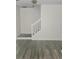 Open living area with wood-style tile flooring and a staircase at 2969 Wynhaven Oaks Way, Lawrenceville, GA 30042