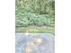 Backyard patio covered with lush landscaping at 2969 Wynhaven Oaks Way, Lawrenceville, GA 30042