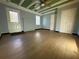 Inviting living room with wood floors, a faux fireplace, updated paint, and a ceiling fan for comfortable living at 1621 Oak Rd, Snellville, GA 30078