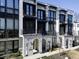 Beautiful townhouses with white brick and black accents featuring private balconies and street view at 2533 Appleden Ne Pl # 22, Brookhaven, GA 30319