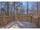 This back deck is made of wood and overlooks the trees at 30 Sampson Ct, Covington, GA 30016