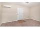 This bedroom features neutral walls, carpet, and a white door at 30 Sampson Ct, Covington, GA 30016
