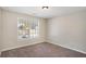 This bedroom features neutral walls, carpet and a window with blinds at 30 Sampson Ct, Covington, GA 30016