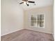 Vaulted bedroom with carpet and a window at 30 Sampson Ct, Covington, GA 30016