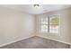 This bedroom features neutral walls, carpet and a window with blinds at 30 Sampson Ct, Covington, GA 30016