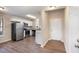Open kitchen with stainless steel appliances, white cabinets, and hardwood floors at 30 Sampson Ct, Covington, GA 30016