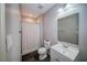 Cozy bathroom featuring modern fixtures, a shower with a curtain, and stylish gray walls at 310 Market Ct, Canton, GA 30114