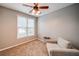 Bright, carpeted bedroom with a ceiling fan and natural light at 310 Market Ct, Canton, GA 30114