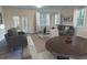 Spacious living room with ample natural light, neutral paint, and seamless flow to adjacent dining area at 3017 Acacia Cir, Douglasville, GA 30135