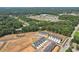 Aerial view of a new construction community surrounded by lush green trees at 321 Crimson Dr, Union City, GA 30291