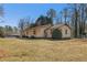 Ranch-style home with a spacious yard, mature trees, and a detached garage at 3439 Elm Creek Nw Dr, Marietta, GA 30064