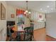 Eat-in kitchen featuring white cabinets, wood floors, and abundant natural light at 3439 Elm Creek Nw Dr, Marietta, GA 30064