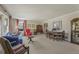 Bright living room with large windows, neutral carpet, and classic furnishings at 3439 Elm Creek Nw Dr, Marietta, GA 30064