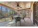 Screened porch with table and chairs overlooking a wooded lot at 3439 Elm Creek Nw Dr, Marietta, GA 30064