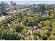An aerial view of townhomes within a city with a lush tree canopy at 52 Ivy Chase Ne, Atlanta, GA 30342