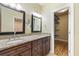 Well-lit bathroom featuring double sinks, a granite countertop, and ample storage space for a practical design at 52 Ivy Chase Ne, Atlanta, GA 30342