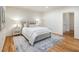 Spacious bedroom with plush rug, neutral tones, and decorative lighting at 52 Ivy Chase Ne, Atlanta, GA 30342
