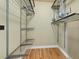 Walk-in closet with custom shelving and organization systems that offer ample storage space at 52 Ivy Chase Ne, Atlanta, GA 30342