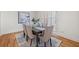 Bright dining room with hardwood floors, modern art, and seating for six at 52 Ivy Chase Ne, Atlanta, GA 30342
