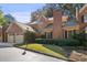 Brick townhome showcasing a well-maintained exterior and lush greenery at 52 Ivy Chase Ne, Atlanta, GA 30342