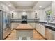 Well-lit kitchen includes stainless appliances and a convenient island at 52 Ivy Chase Ne, Atlanta, GA 30342