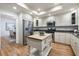 Spacious eat-in kitchen with custom cabinets, stainless appliances, and butcher block island at 52 Ivy Chase Ne, Atlanta, GA 30342