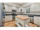 Well-lit kitchen features white cabinets, stainless steel appliances, and an island at 52 Ivy Chase Ne, Atlanta, GA 30342