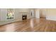 Bright living room featuring hardwood floors and a cozy fireplace at 52 Ivy Chase Ne, Atlanta, GA 30342