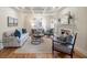 Bright living room features a fireplace, large windows with shutters, hardwood floors, and stylish decor at 52 Ivy Chase Ne, Atlanta, GA 30342