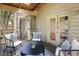 Cozy screened porch with wood floors and comfortable seating area at 52 Ivy Chase Ne, Atlanta, GA 30342