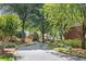Community street view showcasing beautiful landscaping and well-maintained homes at 52 Ivy Chase Ne, Atlanta, GA 30342