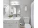 Clean bathroom featuring a white vanity, toilet, and tiled shower-bathtub at 7524 Portbury Park Ln, Suwanee, GA 30024