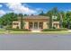 Elegant building exterior with arched entryways and well-manicured landscaping at 7524 Portbury Park Ln, Suwanee, GA 30024