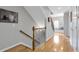 Bright foyer with hardwood floors, staircase, and natural light, creating an inviting entrance at 7524 Portbury Park Ln, Suwanee, GA 30024