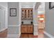 Hallway featuring a built-in cabinet for storage and display at 7524 Portbury Park Ln, Suwanee, GA 30024