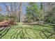 Expansive backyard boasting lush greenery, a wooden deck, and mature trees for serene outdoor living at 2447 Caladium Ne Dr, Atlanta, GA 30345