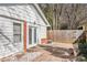 Charming backyard with a stone patio, complemented by a classic brick chimney and wooden fencing at 2447 Caladium Ne Dr, Atlanta, GA 30345