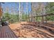 Spacious wooden deck offers ample seating and relaxation, with a grill, benches, and pergola at 2447 Caladium Ne Dr, Atlanta, GA 30345