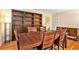 Bright dining room features hardwood floors, built-in shelving, and a large wood table with seating for six at 2447 Caladium Ne Dr, Atlanta, GA 30345