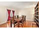 Elegant dining room with a large table, hardwood floors, and doors leading to an outdoor space at 2447 Caladium Ne Dr, Atlanta, GA 30345