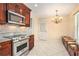 Bright kitchen with stainless appliances, granite countertops, tile backsplash, and a charming dining nook at 2447 Caladium Ne Dr, Atlanta, GA 30345