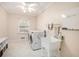 Well-lit laundry room features a modern washer and dryer, utility sink, and ample storage space at 2447 Caladium Ne Dr, Atlanta, GA 30345
